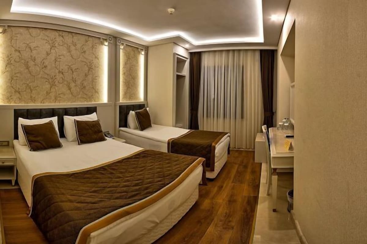 Ropa de cama de alta calidad, minibar, caja fuerte y escritorio