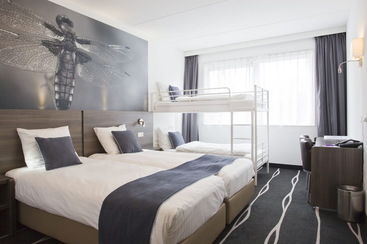 family room (2 adults and 2 children) | in-room safe, desk, blackout curtains, iron/ironing board