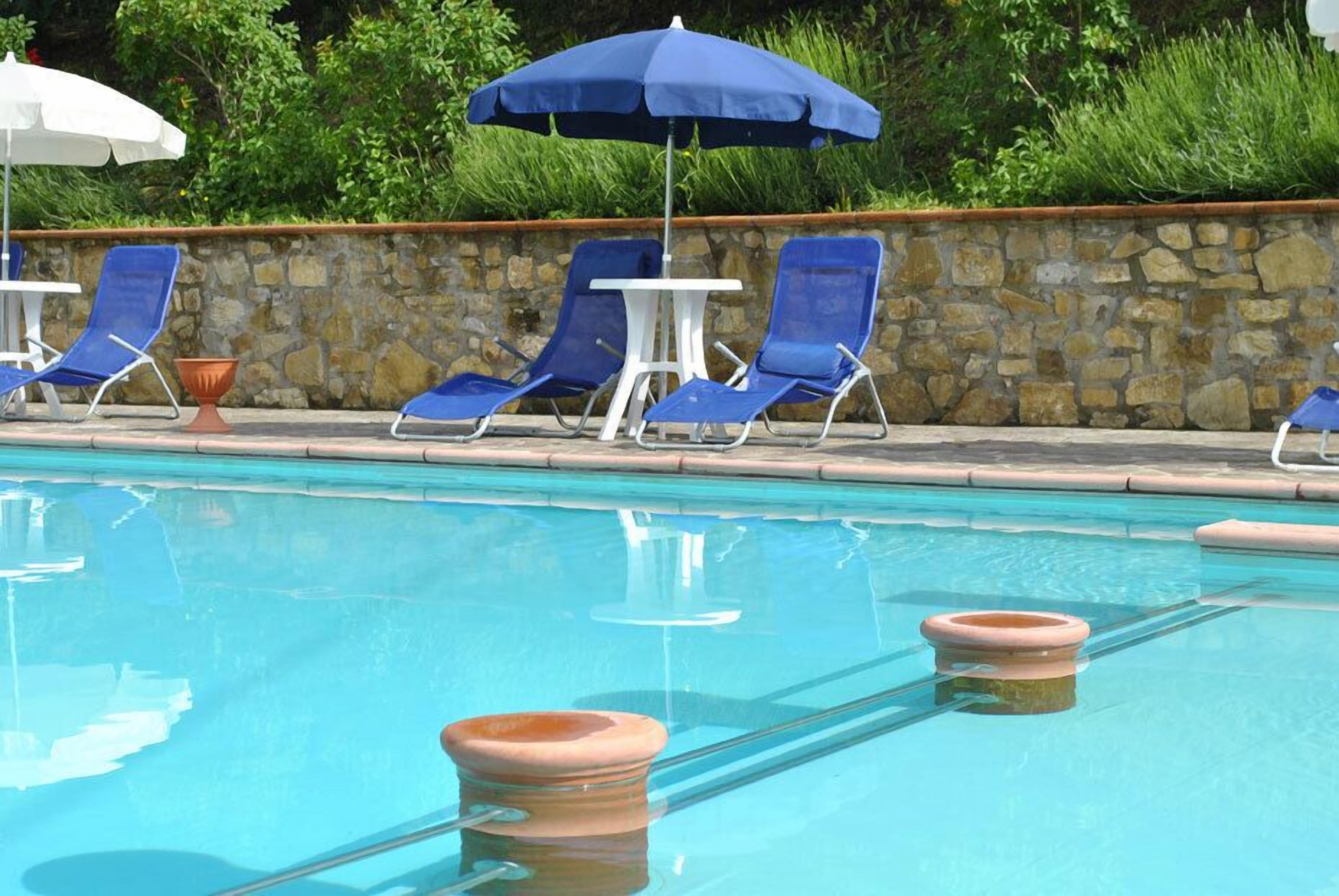 seasonal outdoor pool, pool umbrellas, pool loungers