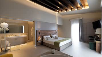 Suite Deluxe, 1 camera da letto | Area soggiorno | TV a schermo piatto