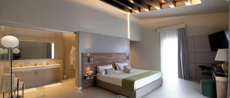 Suite Deluxe, 1 chambre | Coin séjour | Télévision à écran plat