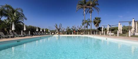 2 outdoor pools, pool umbrellas, pool loungers