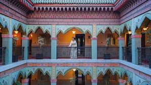 A multi-level atrium with intricate tile work and arches.