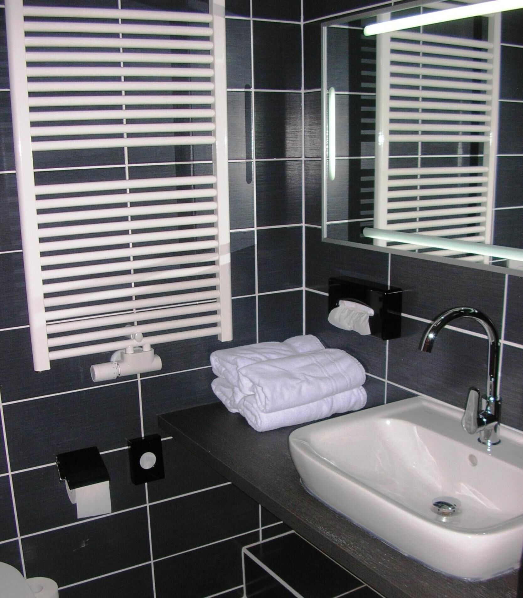 shower, rainfall showerhead, hair dryer, towels