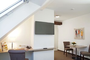 Comfort Studio | Living area | 30-inch flat-screen TV with cable channels, tablet