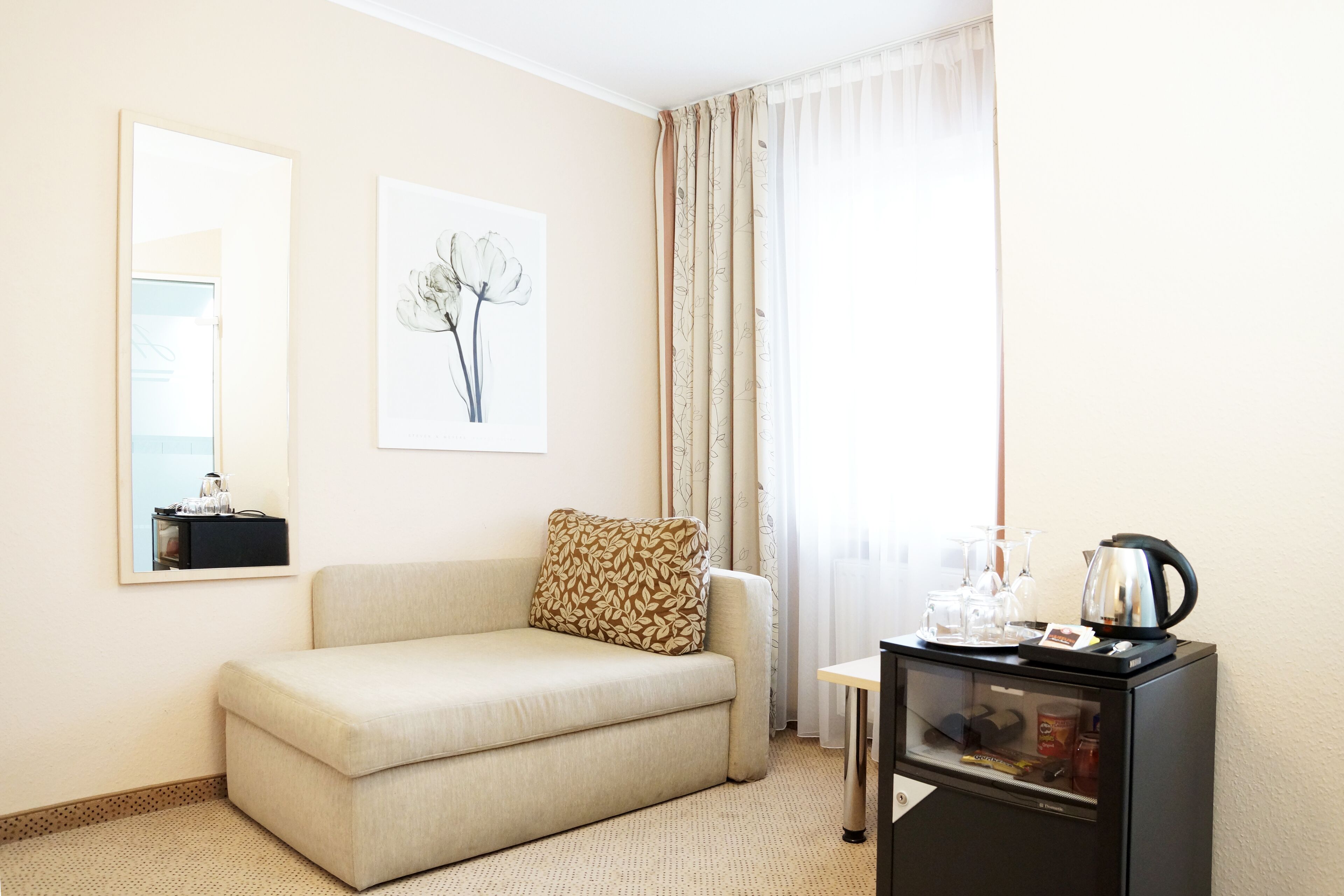 standard single room | living area | 30-inch flat-screen tv with cable channels, tablet