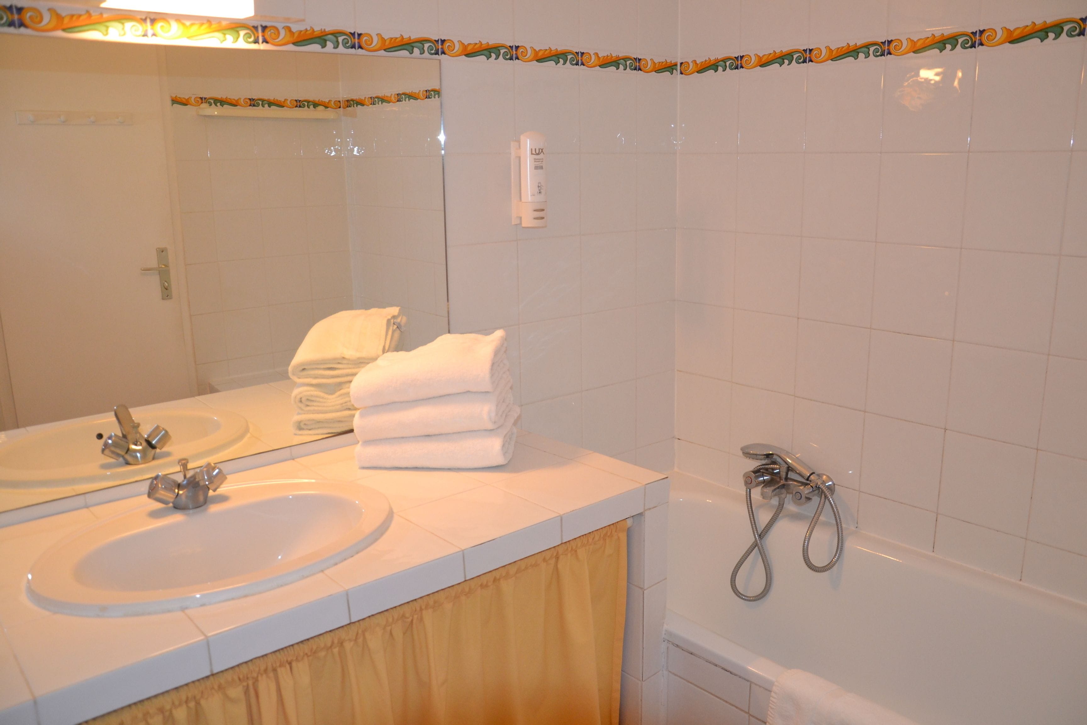 standard triple room | bathroom | hair dryer, towels