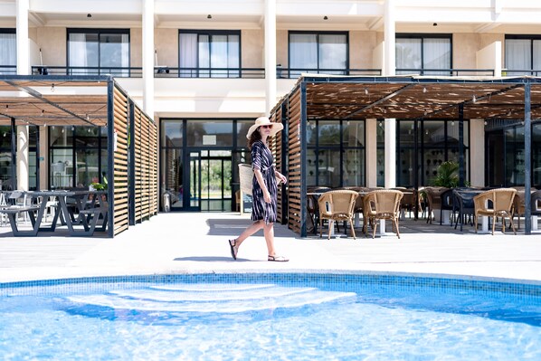 Outdoor pool, open 10:00 AM to 6:00 PM, pool umbrellas, sun loungers