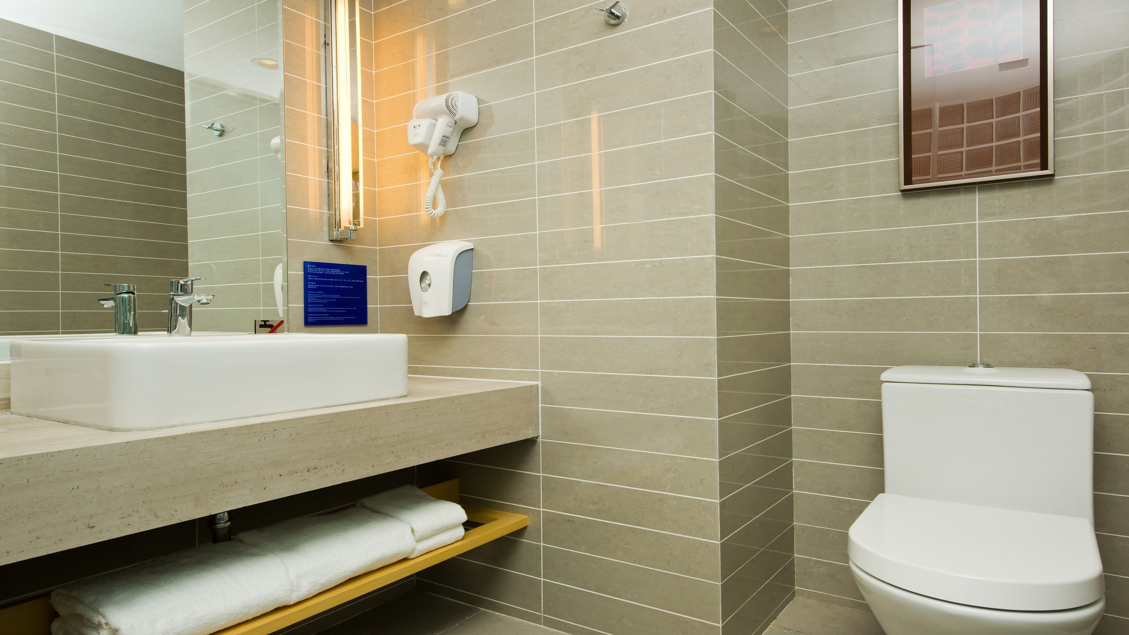 rainfall showerhead, designer toiletries, hair dryer, slippers