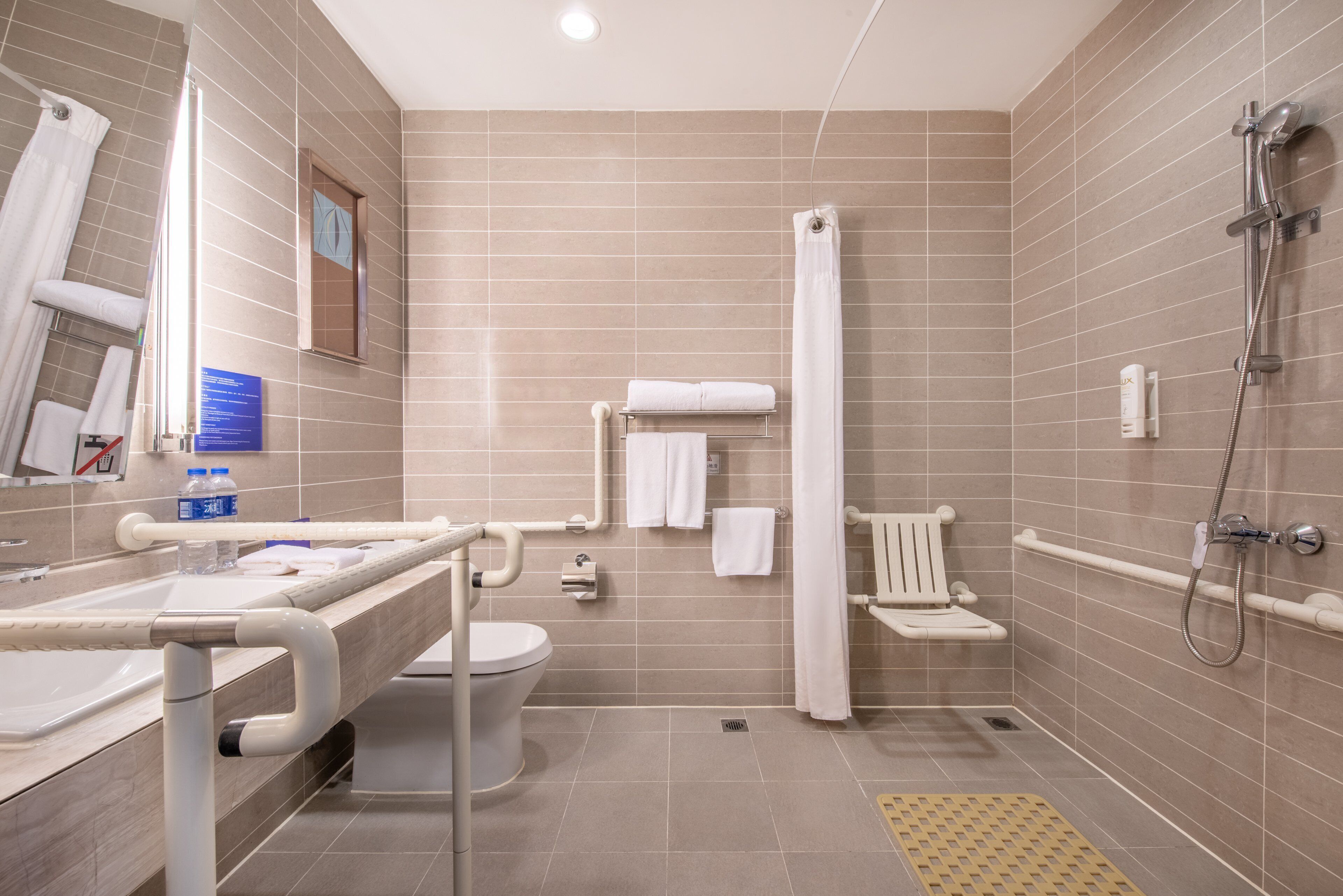 standard room, 1 queen bed, accessible | bathroom | rainfall showerhead, designer toiletries, hair dryer, slippers