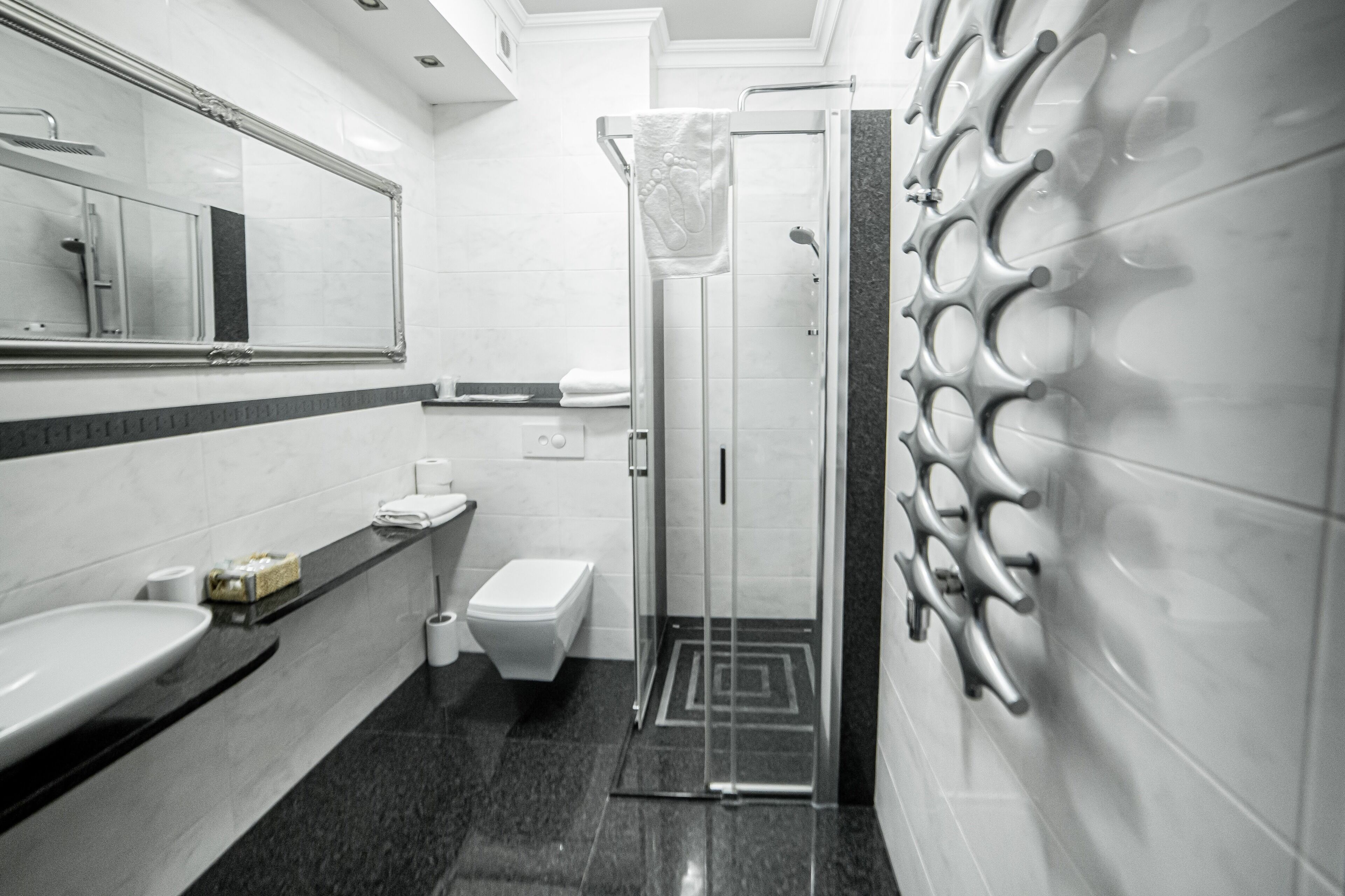 deluxe studio suite, 1 king bed | bathroom | shower, rainfall showerhead, free toiletries, hair dryer