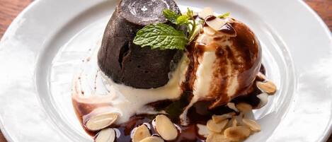 A dessert on a white plate with a wooden table background.