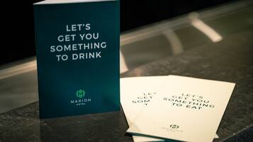 A brochure titled "LET'S GET YOU SOMETHING TO DRINK" from the MARION HOTEL.