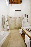 Grand Suite, 1 King Bed, City View | Bathroom | Shower, rainfall showerhead, hair dryer, towels