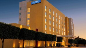 A modern hotel building with a sign reading 'City Express by Marriott' at the top.
