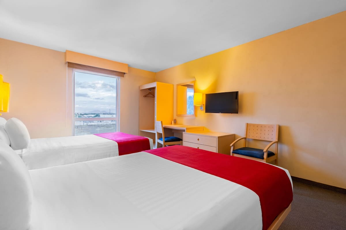 Room, 2 Double Beds | Down duvets, desk, laptop workspace, blackout curtains