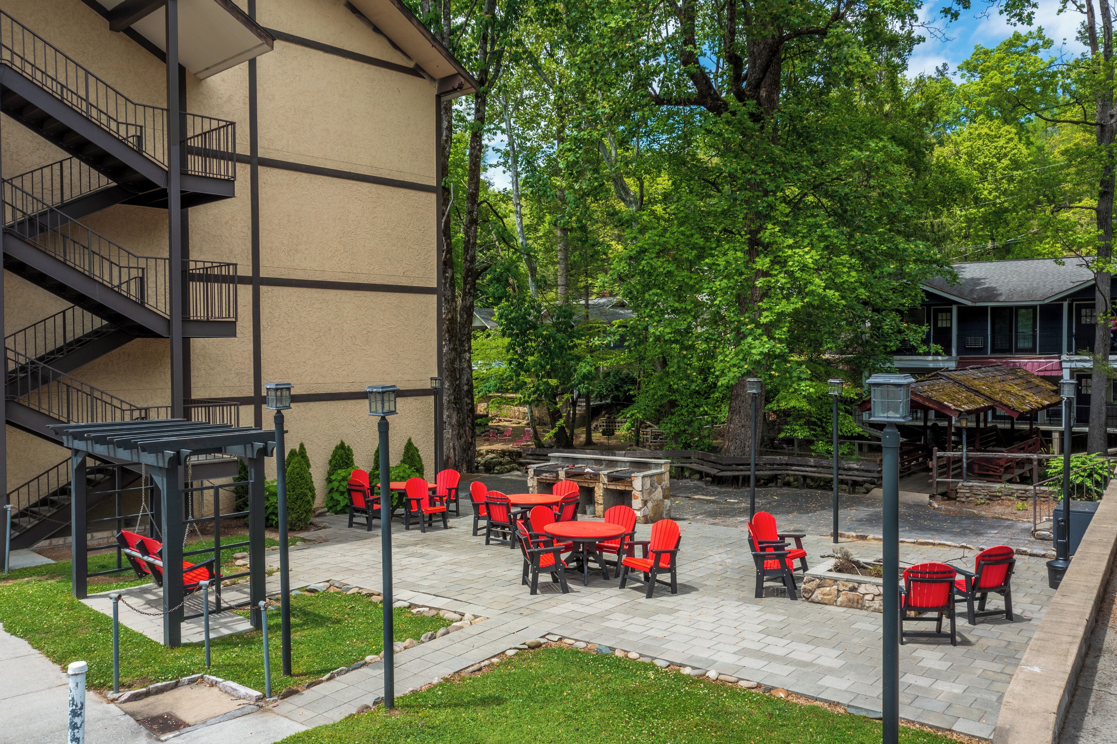 A patio area with outdoor seating and a fireplace.