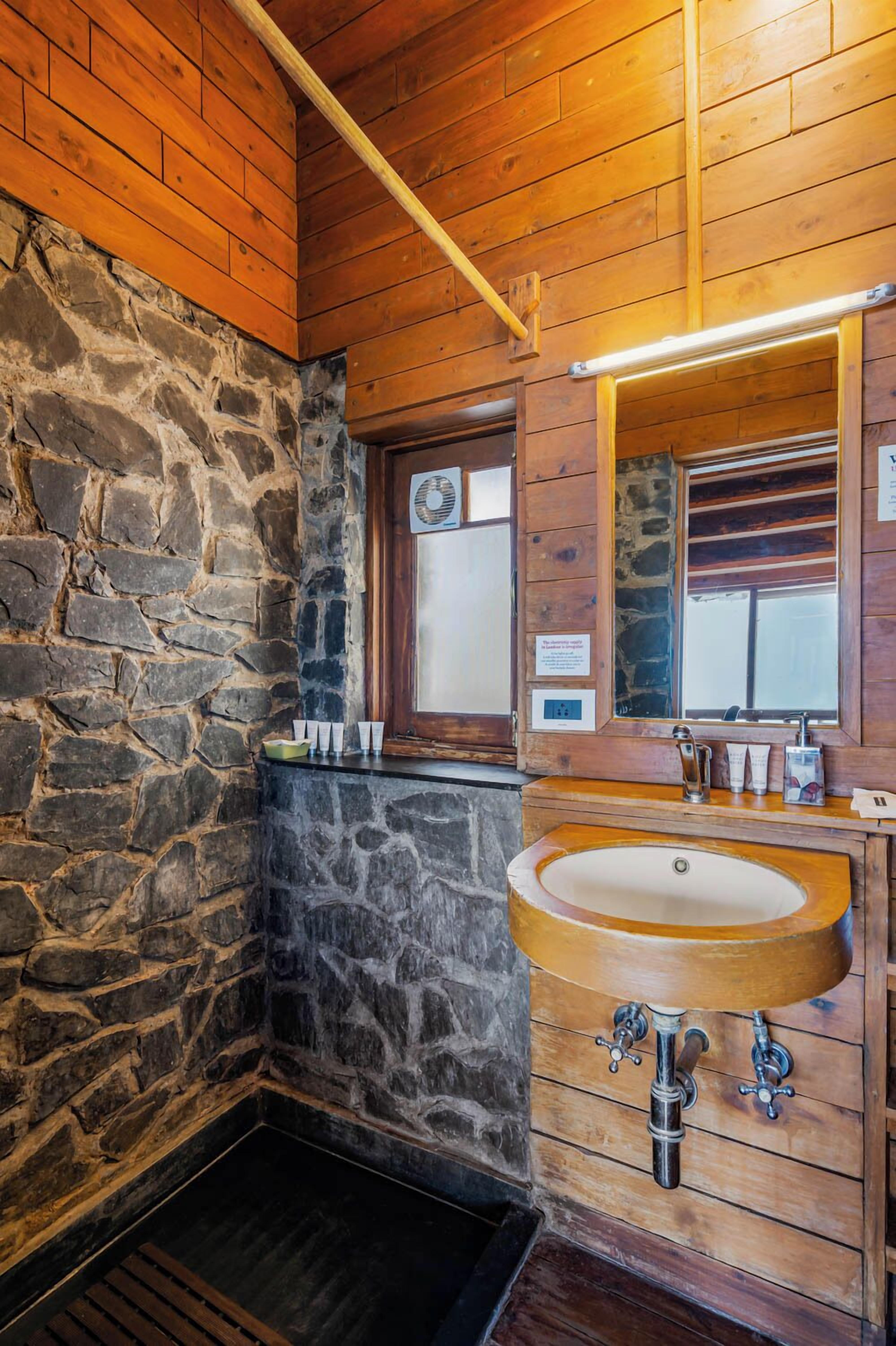 deluxe villa | bathroom | shower, rainfall showerhead, free toiletries, hair dryer