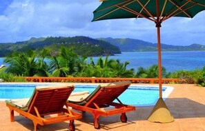 Outdoor pool, pool umbrellas, sun loungers