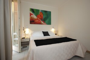 Apartment, 1 Bedroom, Balcony | 2 bedrooms, in-room safe, individually decorated, individually furnished