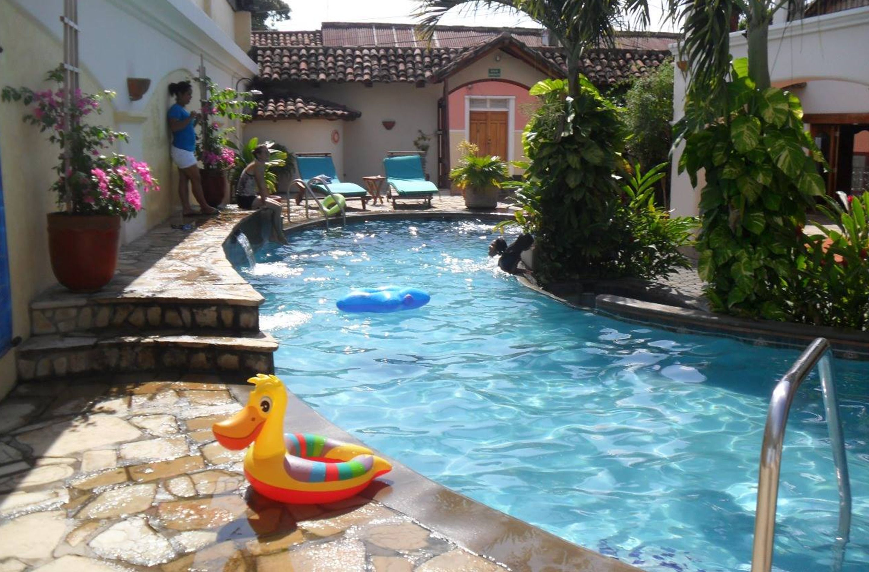 outdoor pool, pool umbrellas, pool loungers