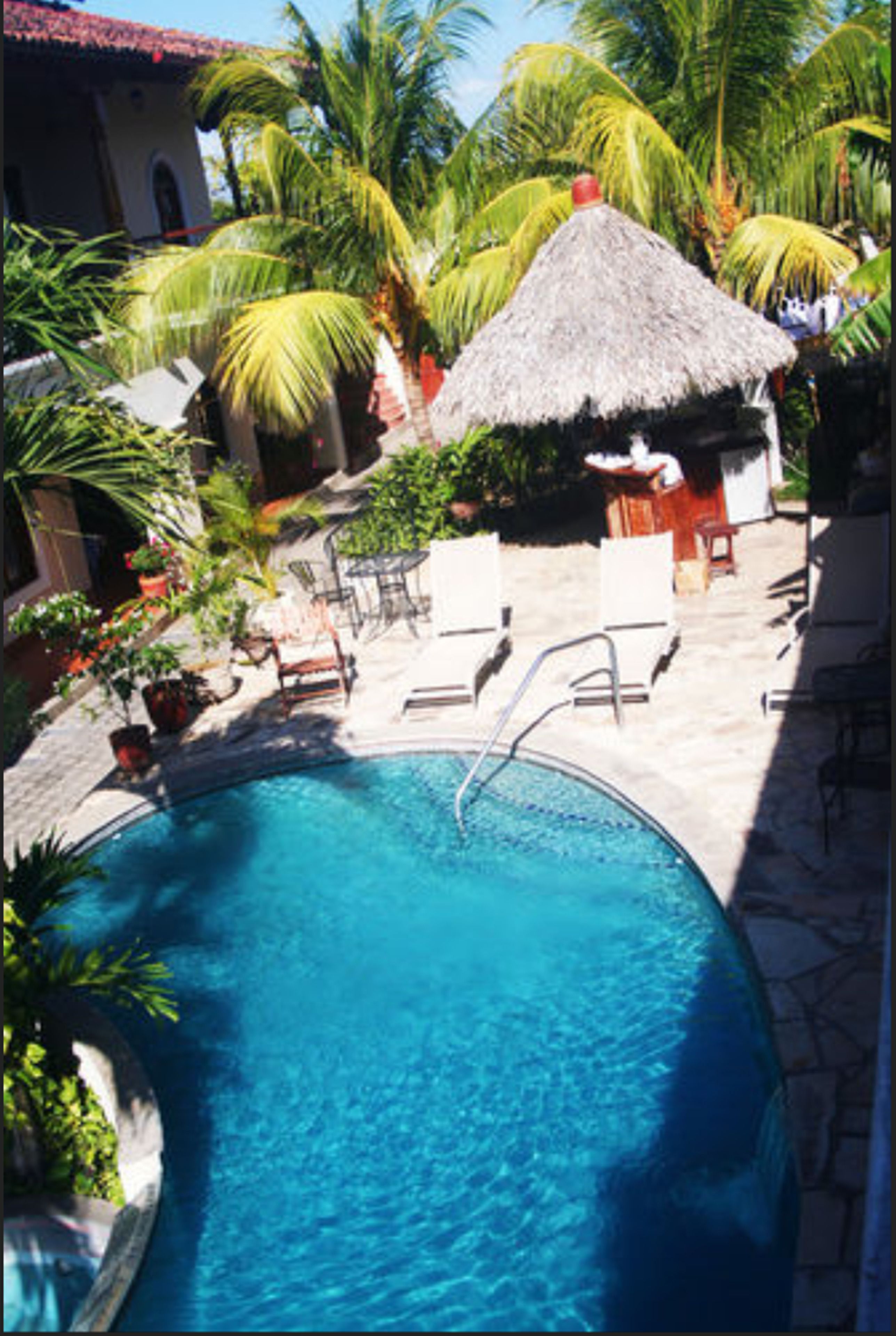 outdoor pool, pool umbrellas, pool loungers