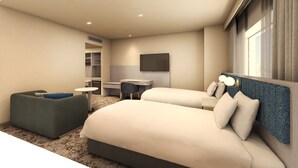 A modern hotel room with a large bed, a desk, a chair, and a small ottoman. - Crowne Plaza - ANA Hamamatsu by IHG (Hamamatsu)