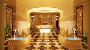 A luxurious hotel lobby with a checkered floor, a reception desk, and two large, ornate bathtub-style fountains. - Guangzhou Masia Hotel (Guangzhou)