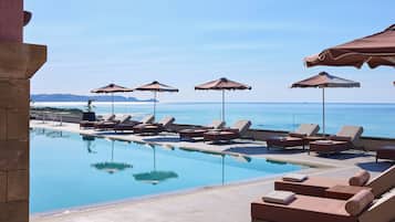 Indoor pool, outdoor pool, pool umbrellas, pool loungers