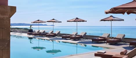 Indoor pool, outdoor pool, pool umbrellas, sun loungers
