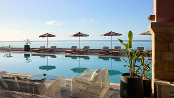 Indoor pool, outdoor pool, pool umbrellas, sun loungers