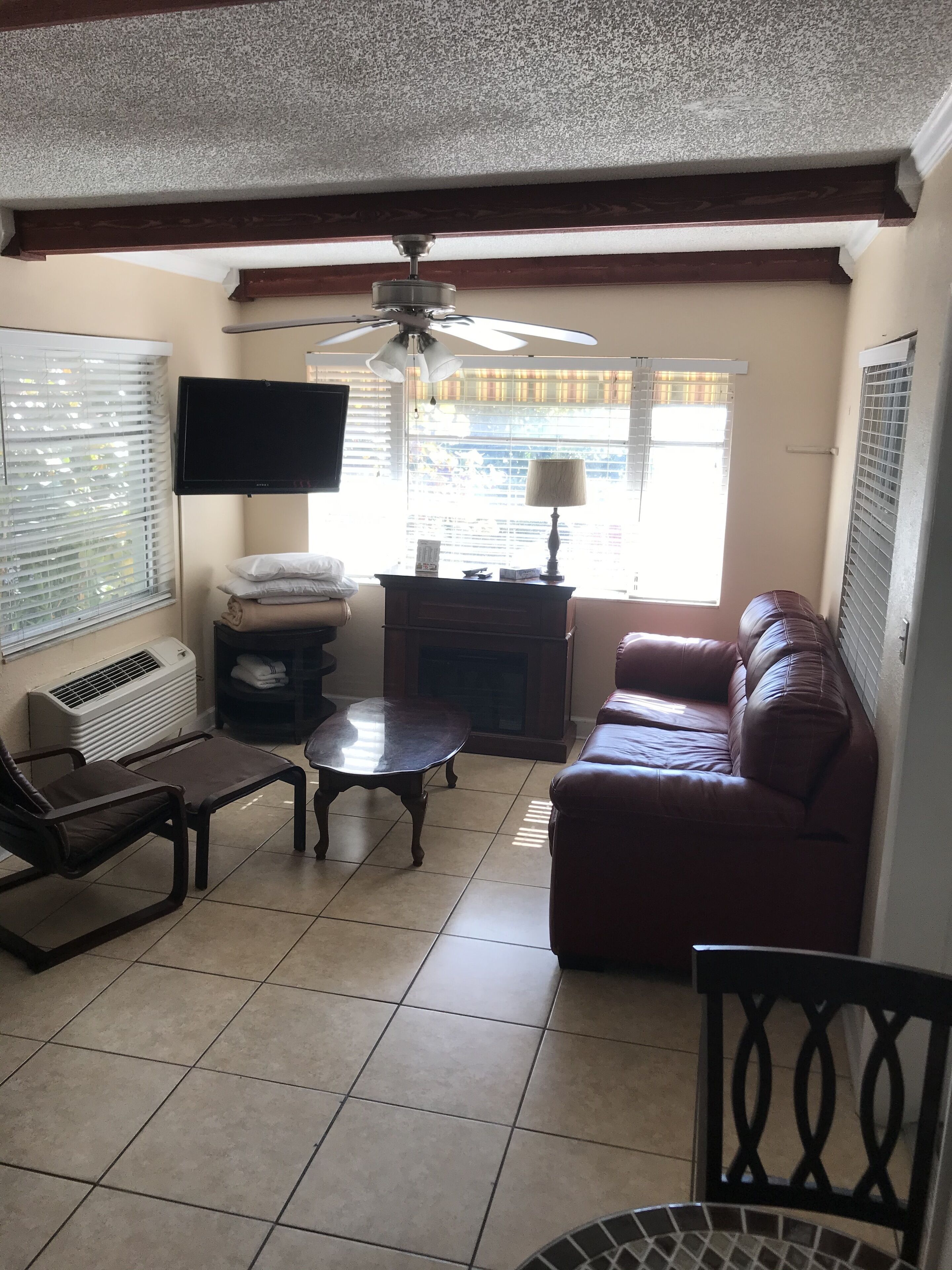 room, 1 queen bed and 1 sofa bed, kitchen, courtyard view, 2nd floor | living room | flat-screen tv