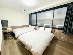 Standard Quadruple Room, Non Smoking | Down comforters, blackout drapes, free WiFi, bed sheets
