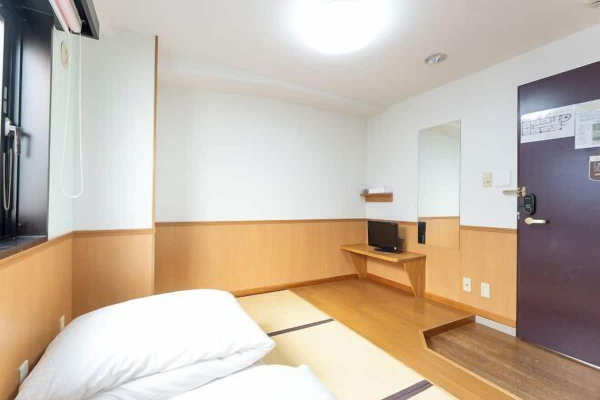 Edredons de pluma, cortinas blackout, Wi-Fi de cortesia, roupa de cama