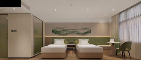 Ein modernes Hotelzimmer mit zwei Betten, einem kleinen Tisch und einem Sessel.