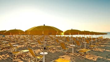 Beach shuttle, sun loungers, beach umbrellas, beach bar