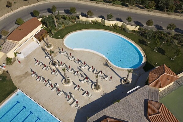 Seasonal outdoor pool, pool umbrellas, pool loungers