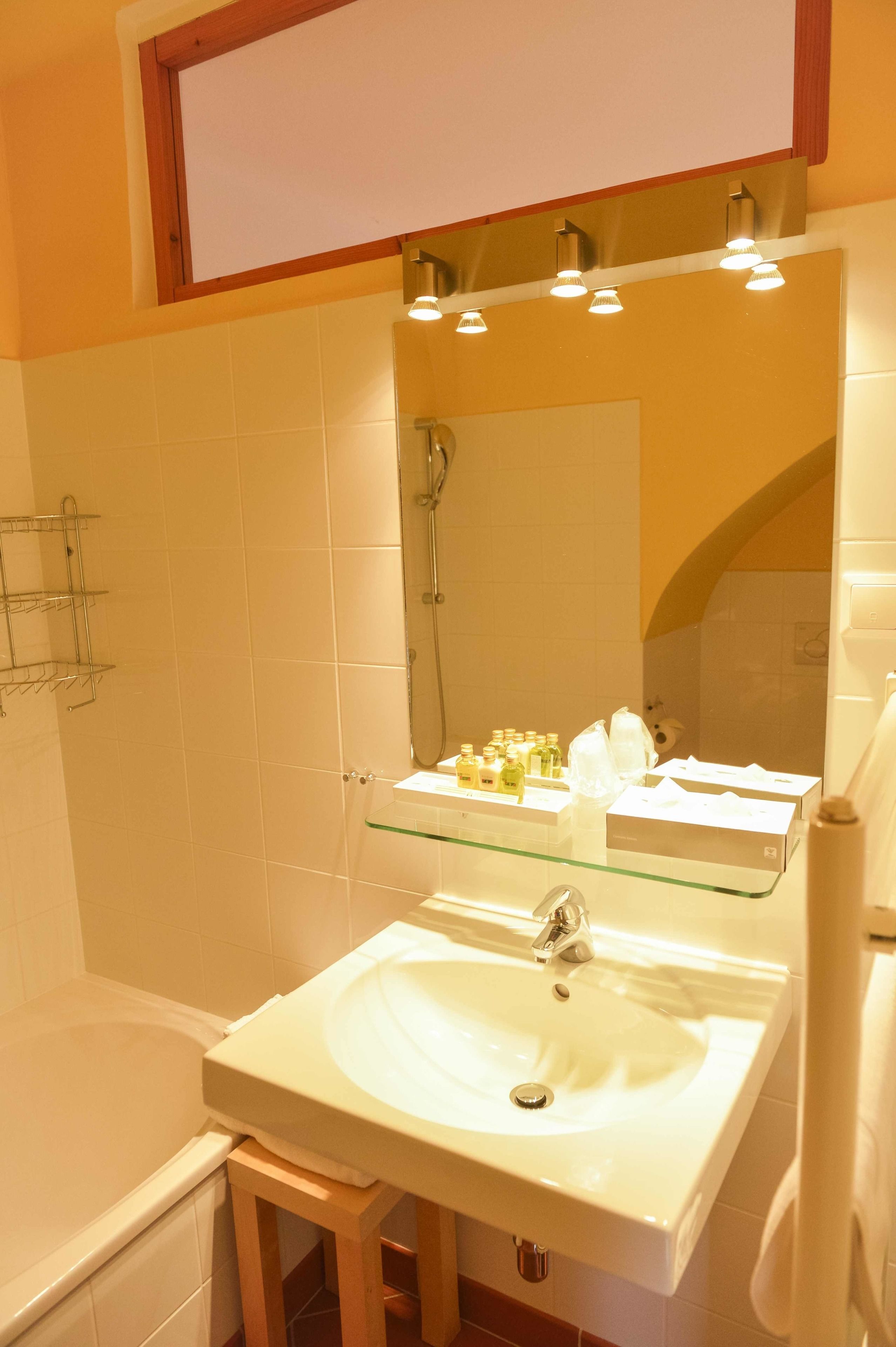 superior double room | bathroom | rainfall showerhead, designer toiletries, hair dryer, slippers