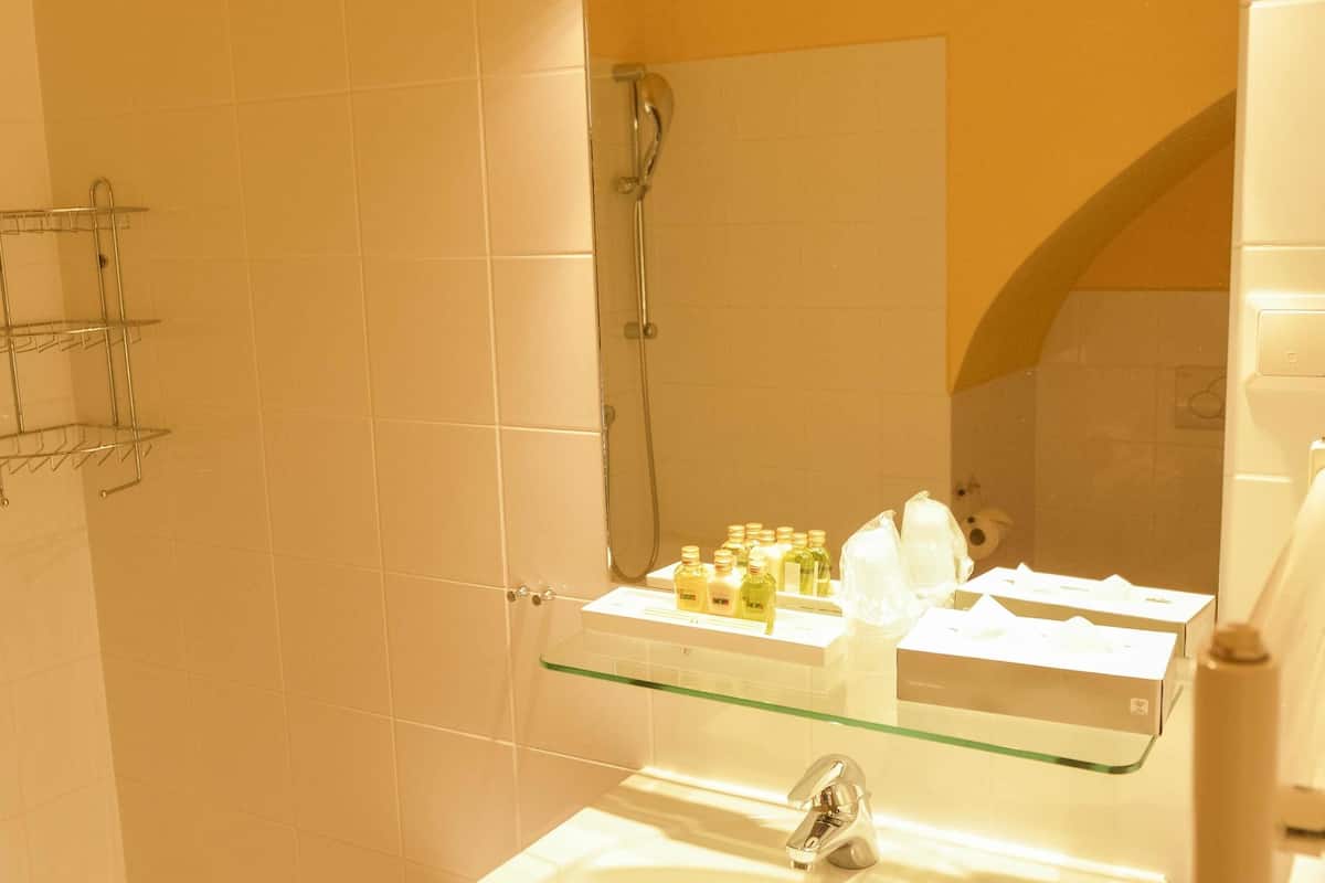 superior double room | bathroom | rainfall showerhead, designer toiletries, hair dryer, slippers