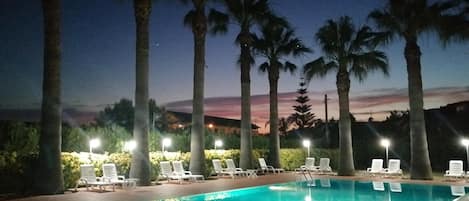 Seasonal outdoor pool, open 9:00 AM to 9:00 PM, sun loungers