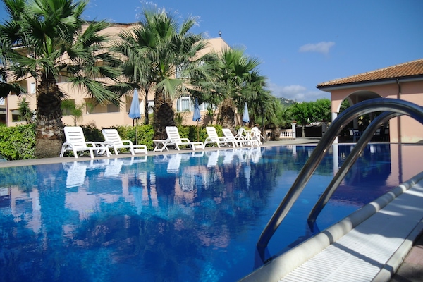 Seasonal outdoor pool, open 9:00 AM to 8:00 PM, sun loungers