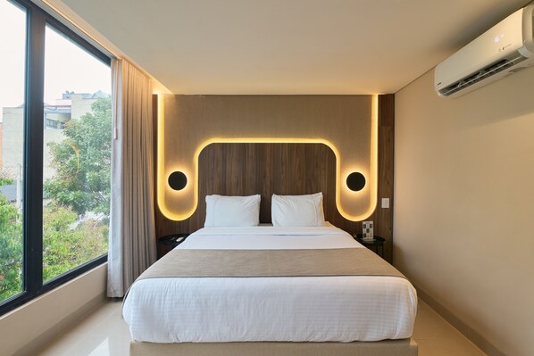 Premium bedding, down duvets, Select Comfort beds, in-room safe