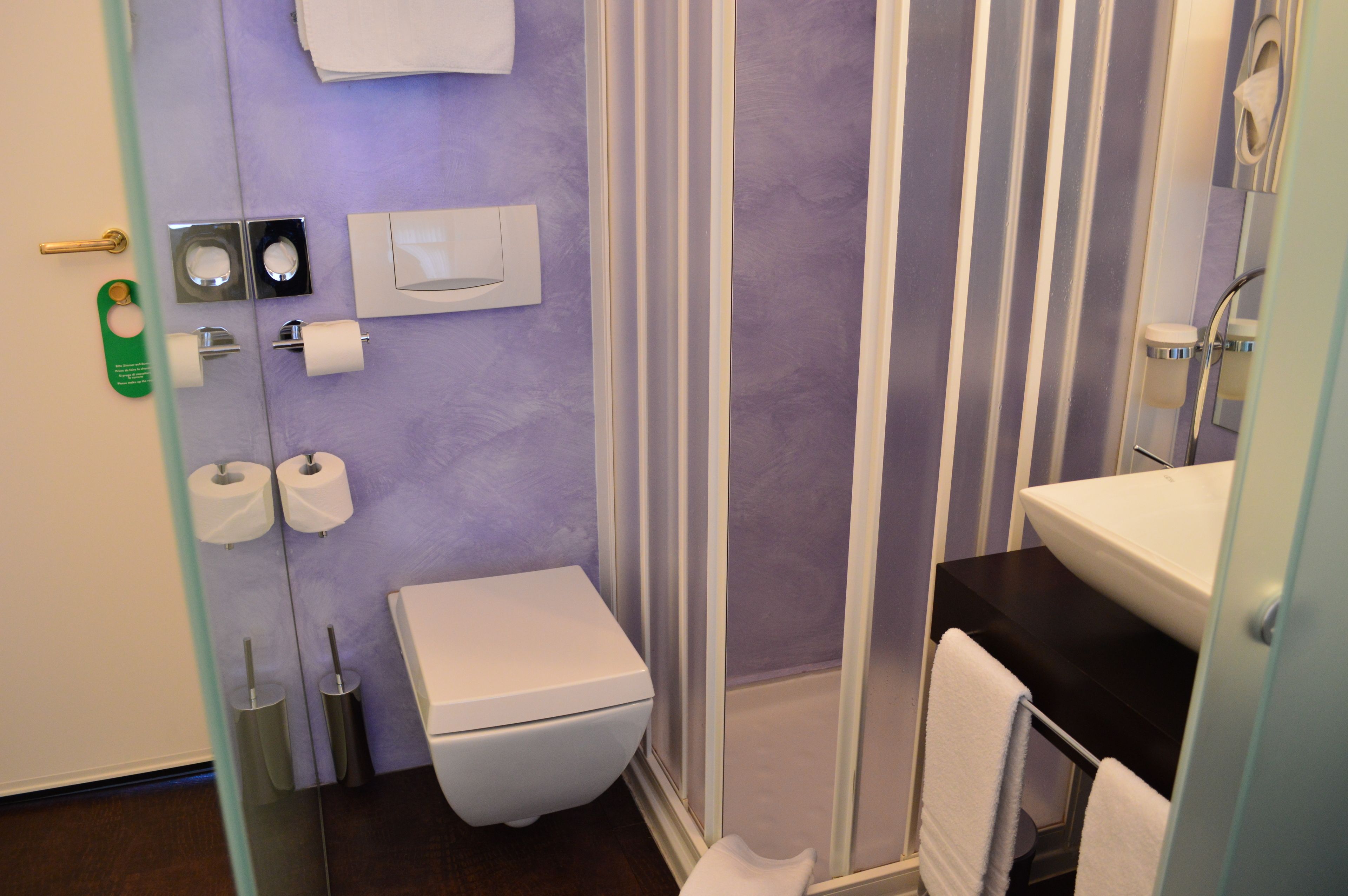 economy double room | bathroom | shower, hair dryer, slippers, towels
