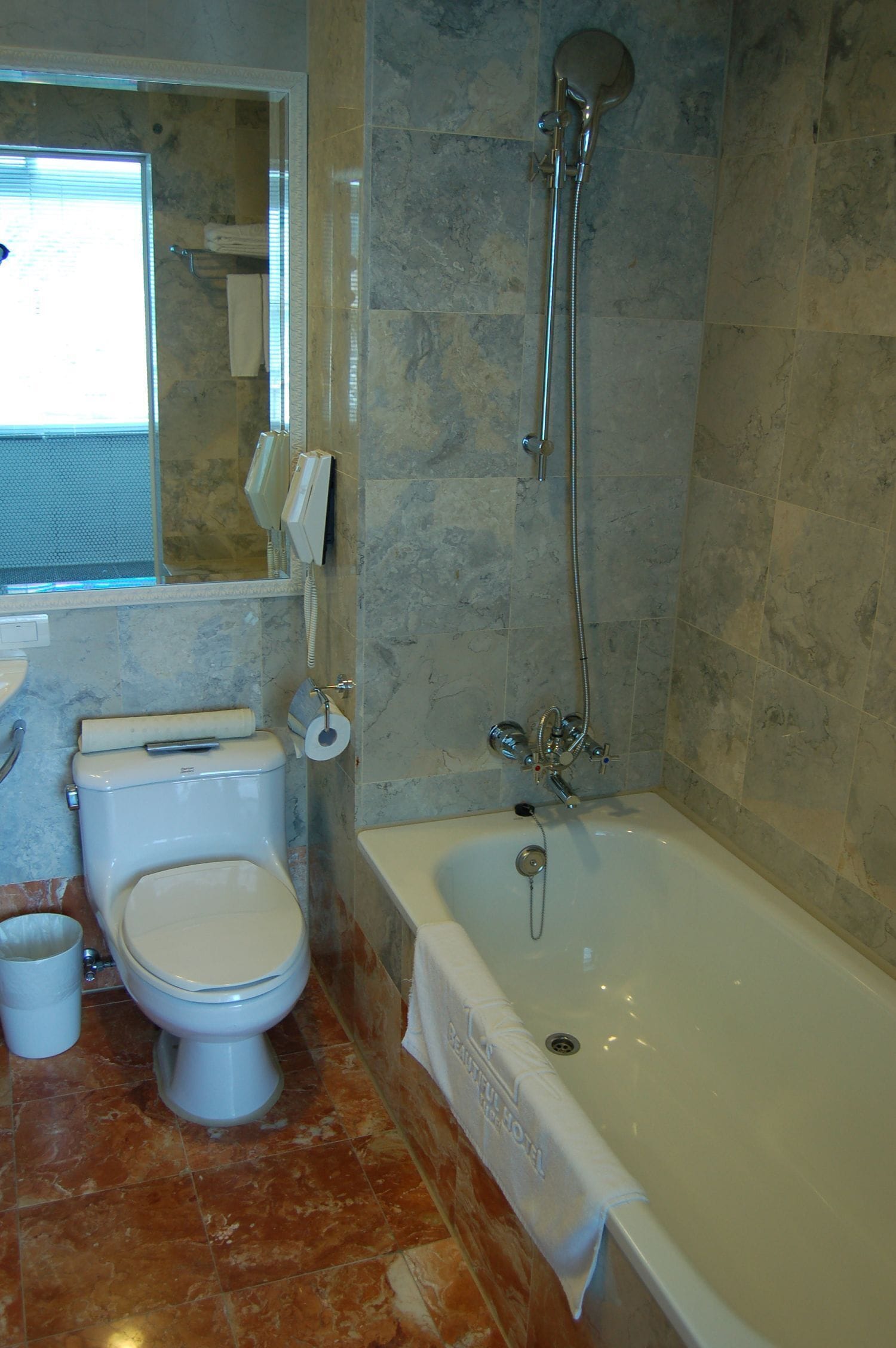 deluxe quadruple room, 2 double beds | bathroom | shower, free toiletries, hair dryer, bathrobes