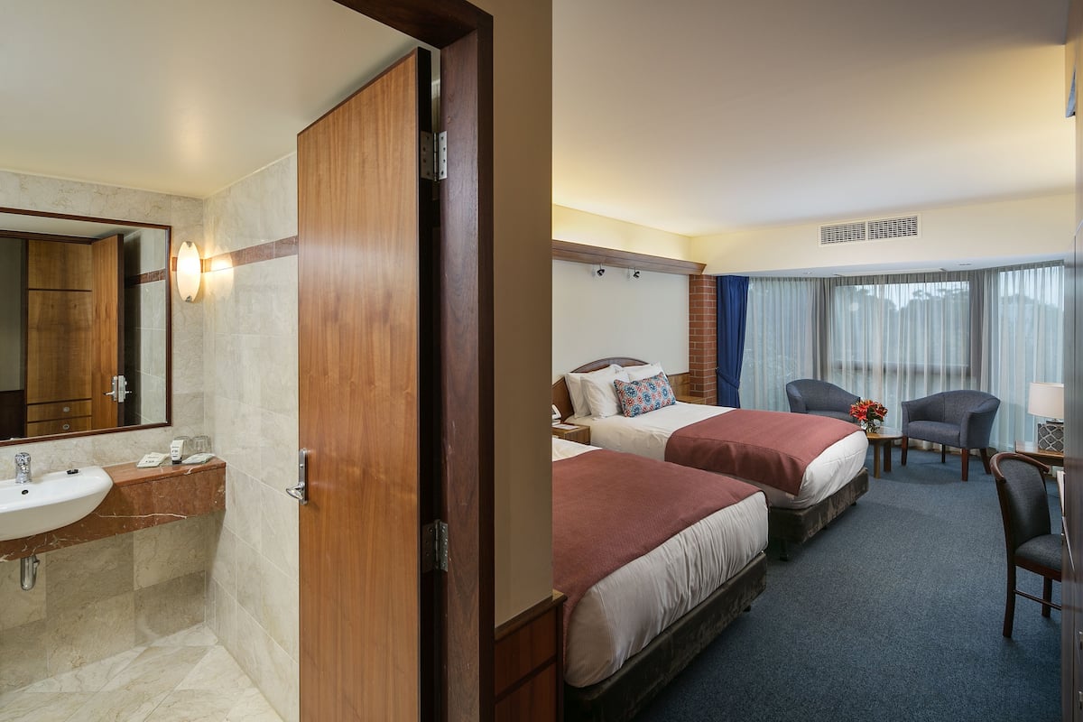 Premium bedding, pillowtop beds, desk, blackout drapes