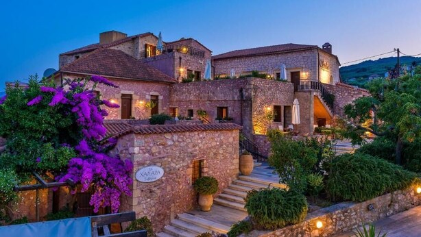 A stone building with a sign reading "XAZAPA Restaurant." - Spilia Village Hotel & Villas (Platanias)
