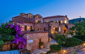 A stone building with a sign reading "XAZAPA Restaurant." - Spilia Village Hotel & Villas (Platanias)