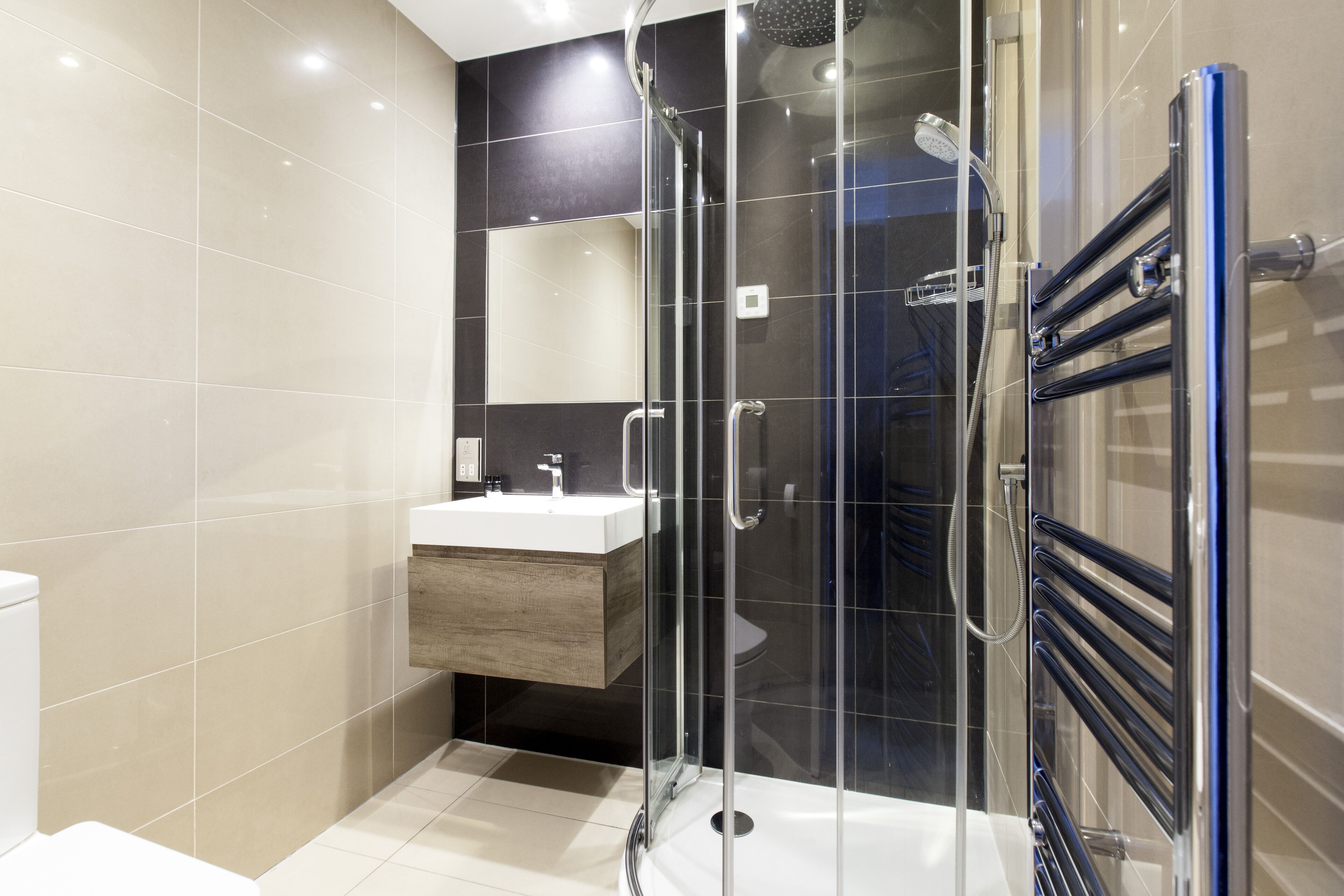 Hydromassage showerhead, designer toiletries, hair dryer, towels