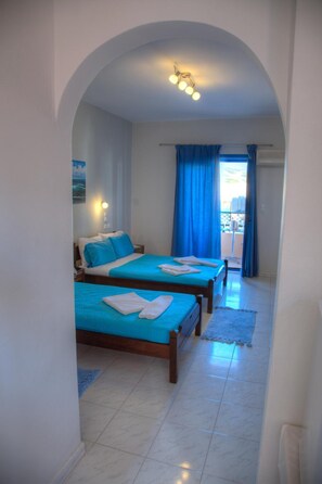 Basic Triple Room, 3 Twin Beds | Desk, blackout drapes, iron/ironing board, free cribs/infant beds - Mochlos Studios (Sitia)