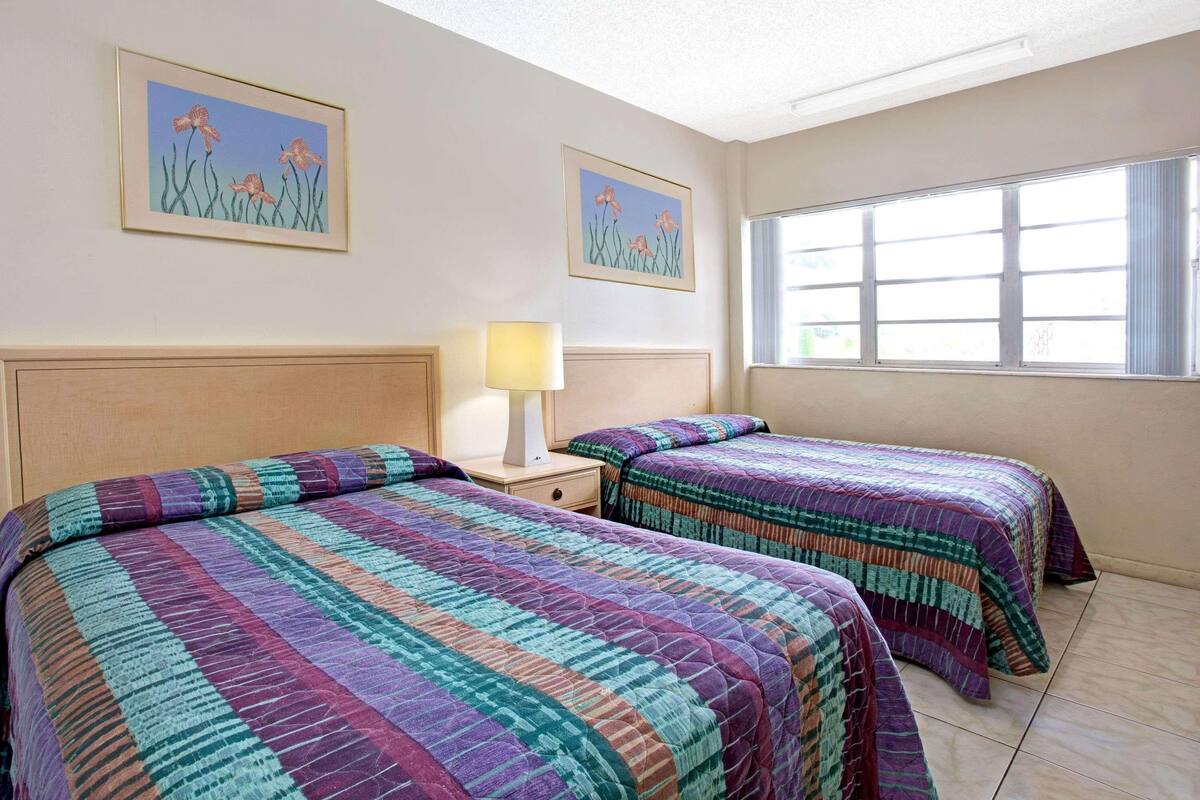 Desk, blackout drapes, bed sheets